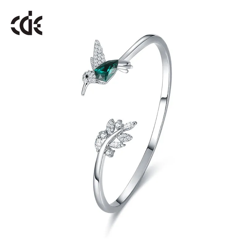 Sterling silver Emerald hummingbird with a shiny leaf bangle