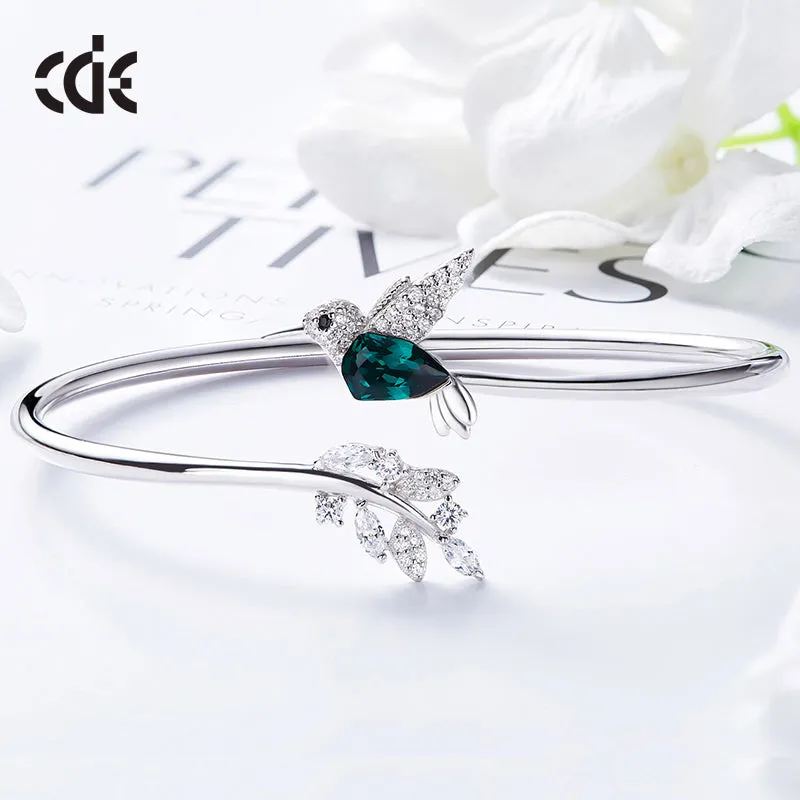 Sterling silver Emerald hummingbird with a shiny leaf bangle