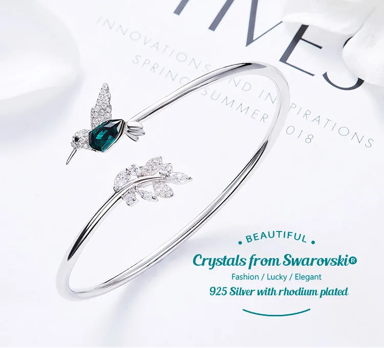 Sterling silver Emerald hummingbird with a shiny leaf bangle